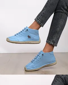 Light blue manual stitched casual shoes for women featuring flat soles and lace-up design.