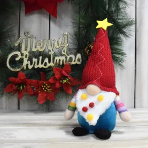 Detailed view of a Christmas gnome with a red knit hat and colorful beard pompoms