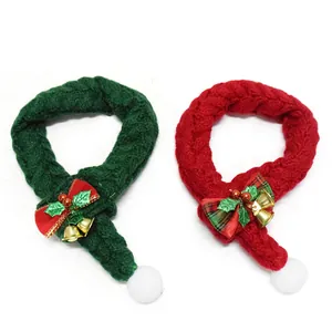 Detail view of red and green knitted Christmas scarves for cats and dogs with bells