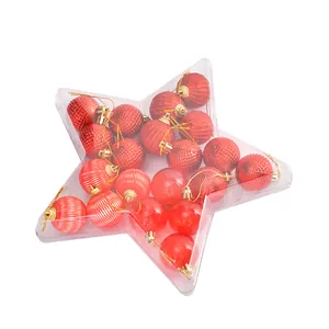 Red Christmas ornaments set in a star-shaped transparent gift box for holiday decor