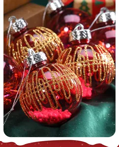 Close-up of red transparent Christmas baubles with gold glitter lattice patterns.