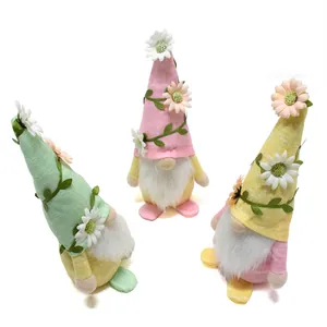 Set of three colorful spring floral gnomes with white daisy decorations and soft beards