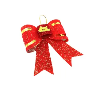 Large double-layered red glitter Christmas bow ornament with gold Merry Christmas sign