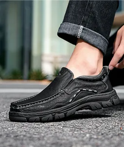 Close-up of men's casual black leather outdoor shoes with hand-stitched details