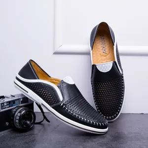 Breathable hollowed black leather loafers for men with vintage camera prop