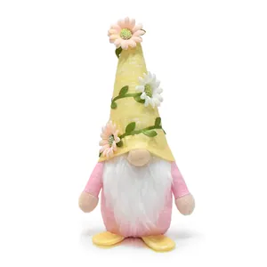 Close-up of a spring gnome plush with a floral hat and pink body for home decor