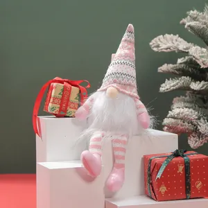 Detailed macro view of a charming pink plush Christmas gnome doll on white display blocks