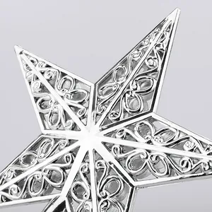 Silver hollowed-out Christmas tree topper star ornament with intricate floral pattern