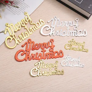 Detail view of metallic Merry Christmas hanging ornaments in gold, silver, and red colors.