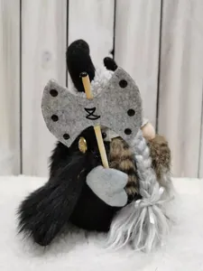 Close-up detail of a Viking warrior gnome plush toy holding a grey felt double axe