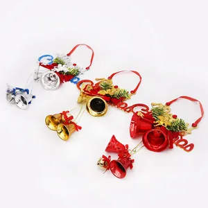 Three festive Christmas bell hangers in red, gold, and silver with Merry Christmas signs.