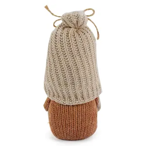 Back detail of a handcrafted knitted faceless gnome doll featuring a beige textured hat.