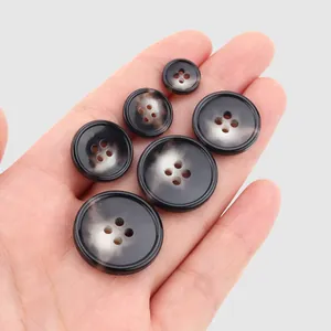 Premium marbled urea buttons in assorted sizes for high-end fashion workwear and coats