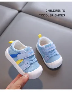 Detail of breathable blue mesh toddler walking shoes with soft white soles