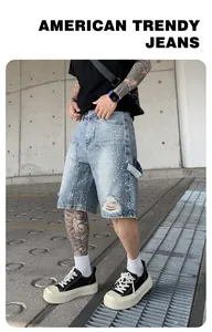 Close-up view of men's distressed denim shorts featuring sparkling rhinestone embellishments.