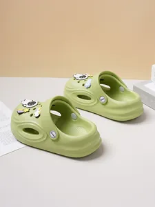Comfortable green children's clogs featuring cute astronaut and space charms detail