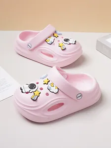 Detailed view of pink toddler clog shoes with cute astronaut and star charms