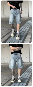 Front view of men's loose denim shorts with rhinestone detailing and distressed accents.