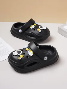 Detailed view of black toddler clogs featuring cute astronaut and space charms