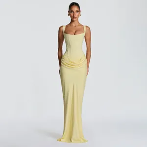 Elegant pale yellow corset maxi dress with square neck and draped skirt for evening