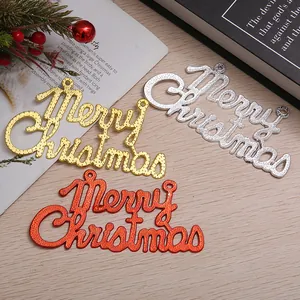 Close-up of Merry Christmas ornaments in gold, silver, and red with dotted texture