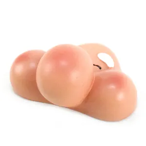 Close-up detail of a handmade resin gnome face mold with a round nose and pink cheeks