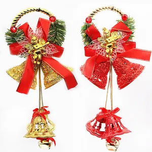 Detail view of gold and red 20cm Christmas bell hangers with angel and bow accents