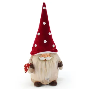 Handcrafted festive Christmas plush gnome ornament with resin face holding a red mushroom