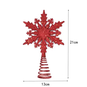 Cime de sapin de Noël en flocon rouge pailleté avec dimensions 21cm par 13cm sur fond blanc