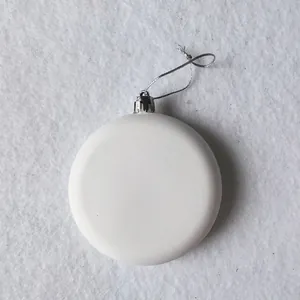 Detailed macro shot of a white matte circular Christmas hanging ornament decoration