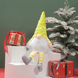 Detail view of a handcrafted Christmas gnome plush with yellow sequined hat and beard