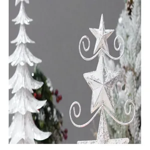 Detailed macro view of a white snowy iron Christmas tree ornament with a star topper