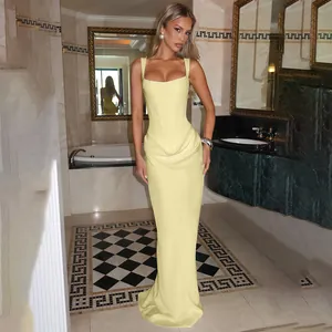 Elegant light yellow square neck maxi dress featuring a slim corset bodice and draped skirt