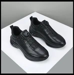 Detailed view of men's black leather sneakers with a rotating buckle and thick soles