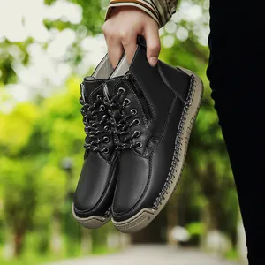 Detailed view of black hand-stitched Martin boots with side zipper and soft rubber sole
