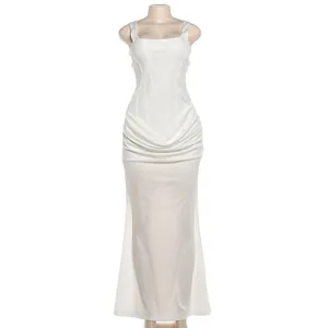 Full-length view of elegant white square neck corset-style dress with draped waist detail