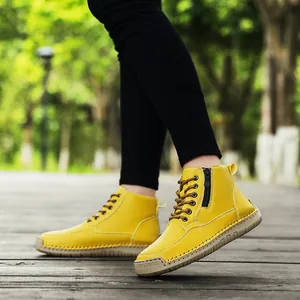Outdoor lifestyle view of yellow handmade stitched Martin boots with side zippers