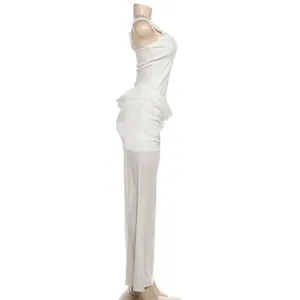 Side profile of white elegant sleeveless long dress with cinched draped waist detail