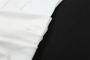 Close-up of white ruched fabric detail showing elegant texture and pleated design