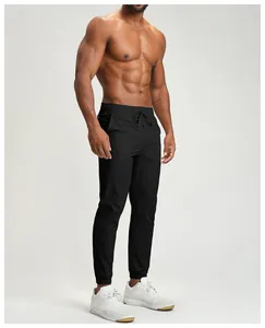 Detailed view of high-performance black quick-dry men's joggers with elastic cuffs.