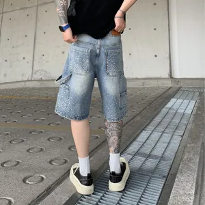 Men's loose straight denim shorts with rhinestones and carpenter pockets in washed blue
