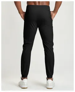 Back view of black breathable quick-dry men's joggers for fitness and outdoor training.