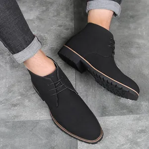 Men's stylish pointed toe casual black leather lace-up chukka boots on grey floor