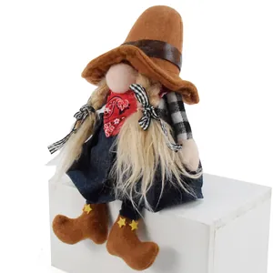 Handmade cowboy girl gnome plush doll with braids and red bandana on white block
