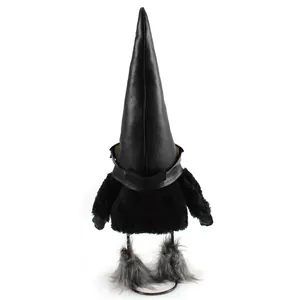 Back view of a trendy black furry gnome doll with a tall pointed leather hat and sunglasses