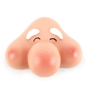 Close-up of resin gnome face accessory with large round nose and rosy cheeks