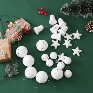 Detailed view of white foam Christmas ornaments including balls, stars, and bells with sequins.