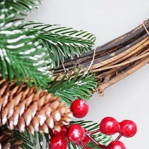 Detailed view of 40cm Christmas wreath with PE pine needles, red berries and cones