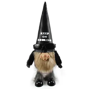 Detailed view of a cool rocking gnome figure wearing sunglasses and a black leather hat.
