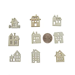 Detailed view of nine mini laser-cut wooden house shapes for DIY Christmas decor.